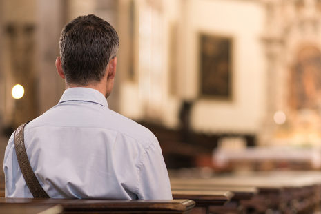 web3-man-sitting-in-a-pew-at-church-and-meditating-faith-and-religion-concept0a-shutterstock_552998536